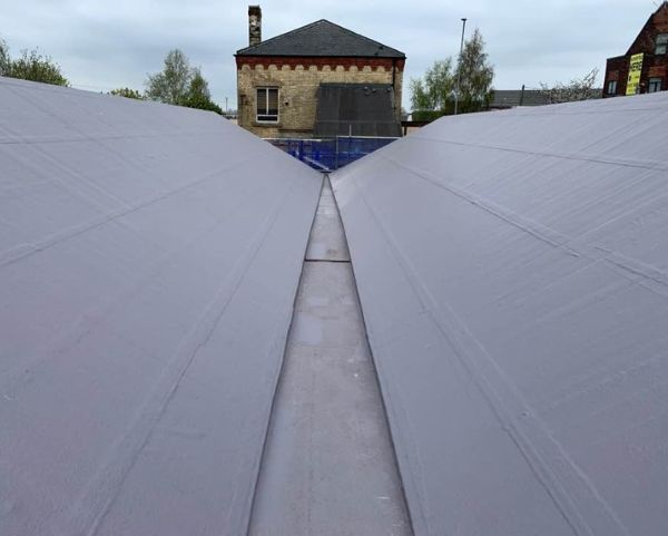 Cold Applied Liquid Roofing Commercial Roofing Train Station (600 × 481px).jpg